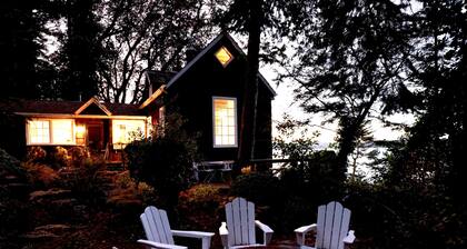 Storybook family cottage perched atop Penn Cove