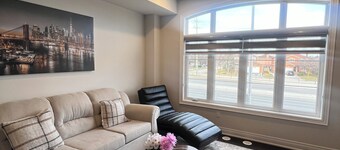 Stylish Three-Level Townhome Near Toronto with Parking and Workspaces