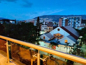 A building with a prominent clock tower and a large stained glass window. - Spacious natural design with panoramic views of Medellín 501 (Medellín)