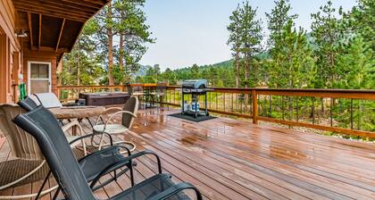 Cozy waterfront river cabin with mountain views, and a hot tub - dog friendly