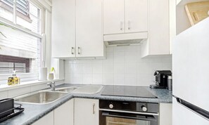 Coffee/tea maker, fridge, microwave, oven