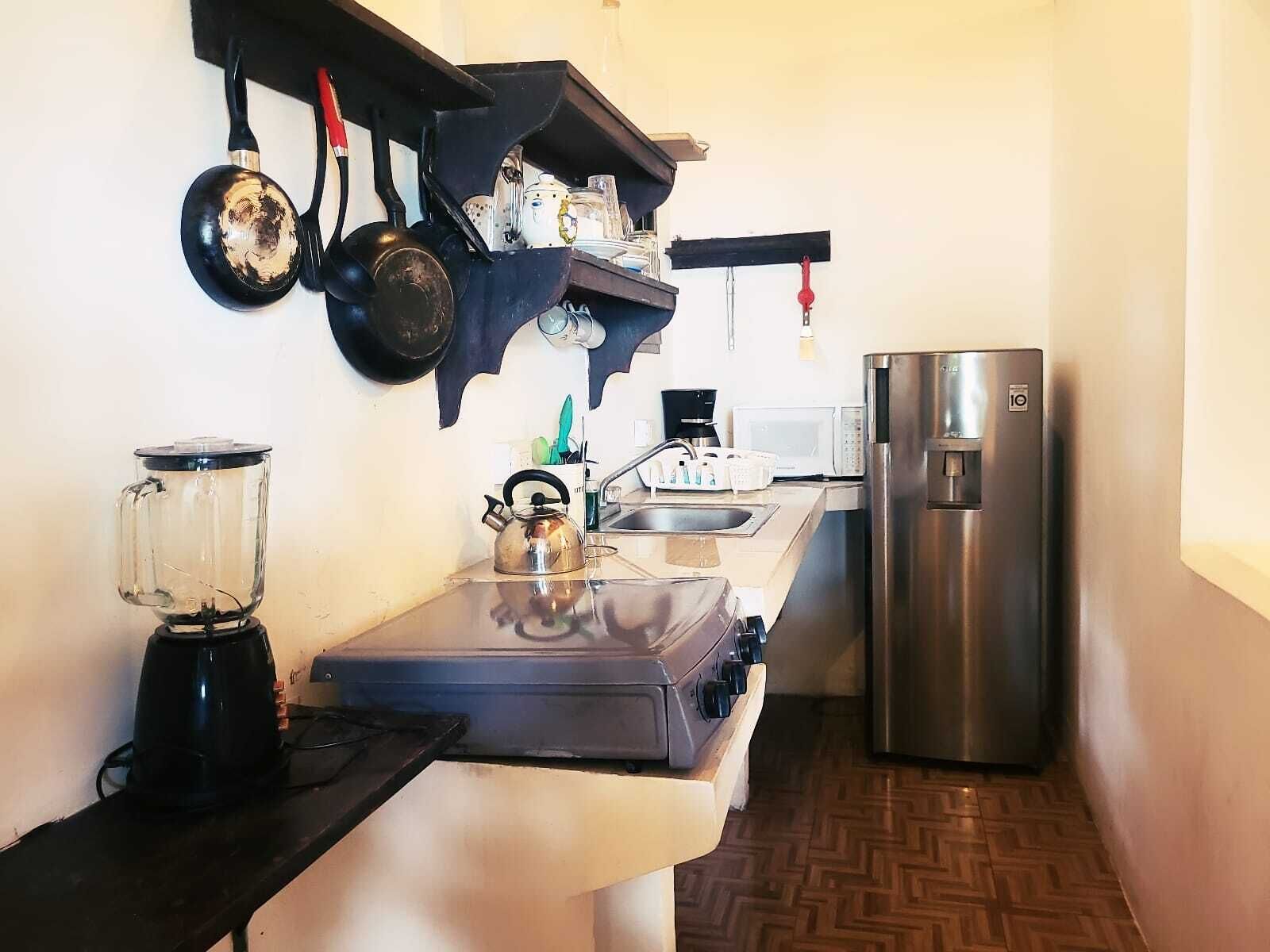 Microwave, coffee/tea maker, cookware/dishes/utensils, spices