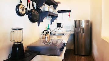 Microwave, coffee/tea maker, cookware/dishes/utensils, spices