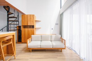 Design villa, uitzicht op zwembad | Woonruimte | Flatscreentelevisie