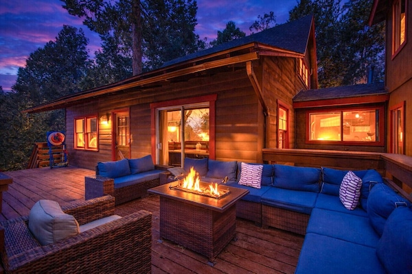 Outdoor deck with fire table and seating.