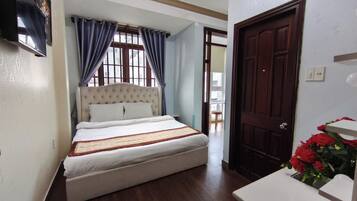 Deluxe Double Room, City View | Blackout drapes, soundproofing, iron/ironing board, free WiFi