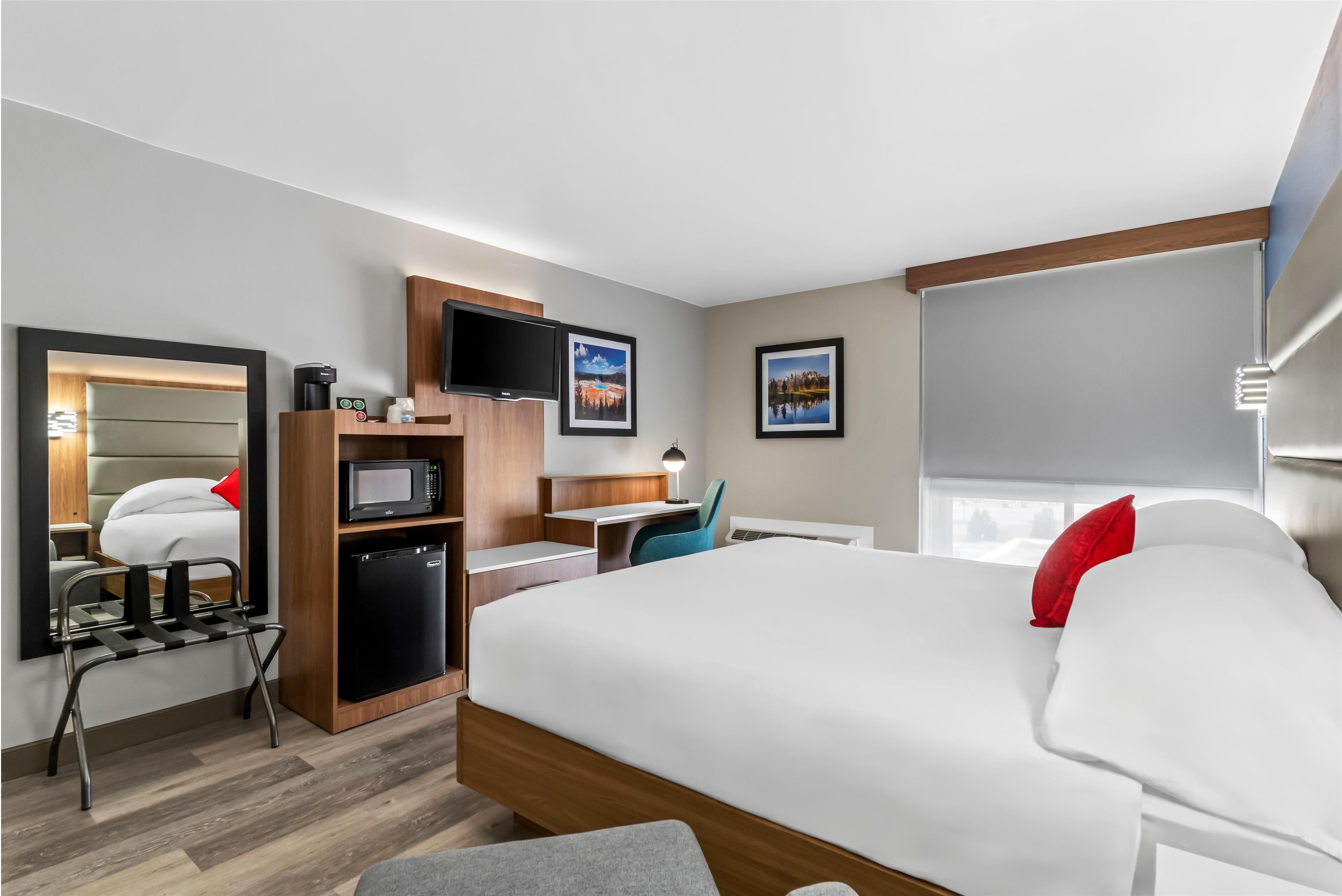 Settle in with a crisp bed, fridge, and workspace.