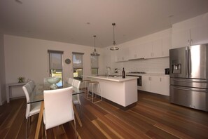 Fridge, microwave, oven, stovetop - Luxury Pet-Friendly 4BR Home, Walk to Beach (Capel Sound)