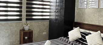 Cozy 1-Bedroom Townhouse with AC, Kitchen & Pool Access Near Malls in Dasmarinas