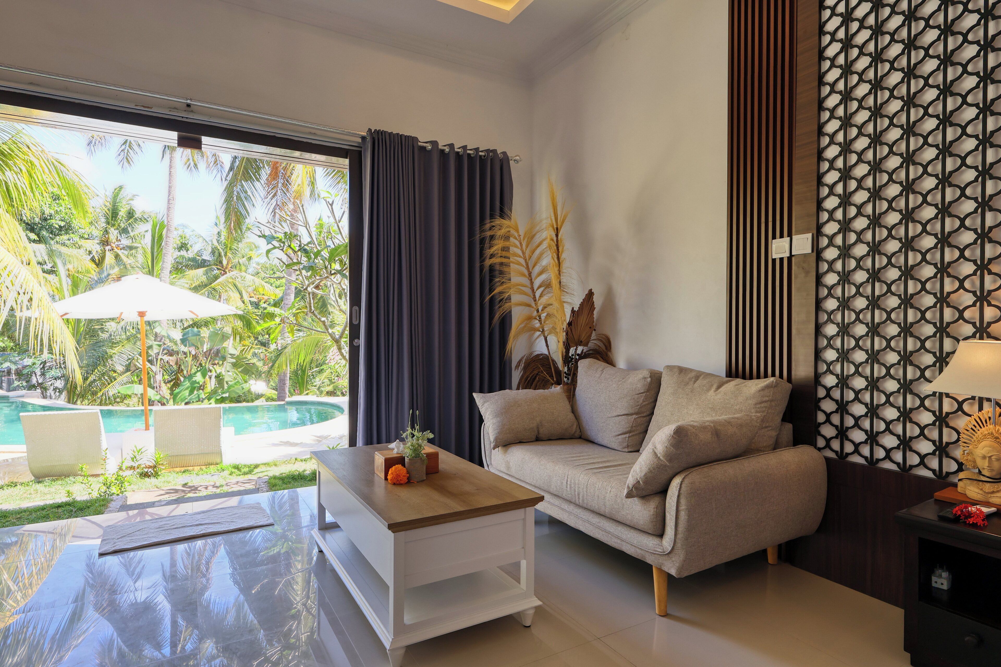 Suite Deluxe | Área de sala de estar