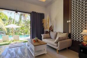 Suite Deluxe | Área de sala de estar