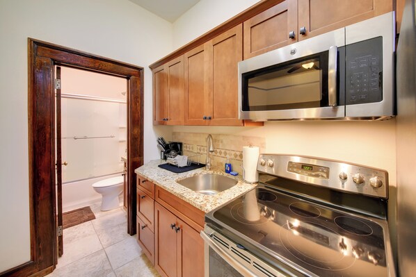 Fridge, microwave, stovetop, coffee/tea maker