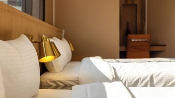 Standard Quadruple Room | Desk, blackout drapes, free WiFi, bed sheets