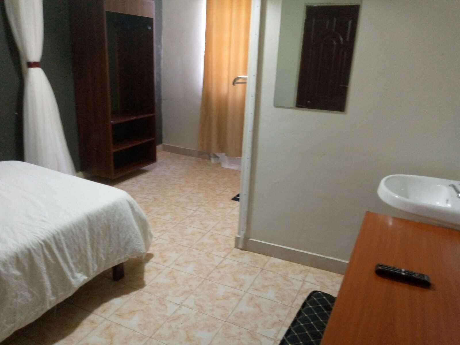 Desk, laptop workspace, blackout curtains, iron/ironing board