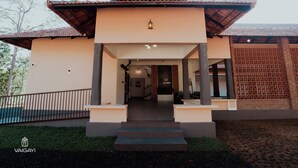 A modern two-story building with a flat roof and a covered entrance. - Vaigayi Ayurvedic Resort (Kunnathunad)