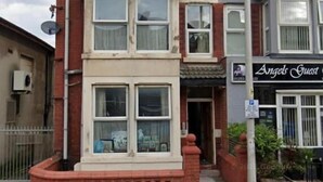A two-story building with a red brick facade, multiple windows, and a sign for 'Angels Guest'. - Reads Avenue - Next To HA Social Club - Winter Gardens and Town Centre! (Blackpool)