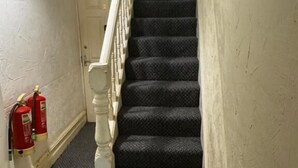 A carpeted staircase with a white handrail and a door at the top. - Reads Avenue - Next To HA Social Club - Winter Gardens and Town Centre! (Blackpool)