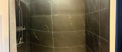 Shower, hair dryer, towels, soap