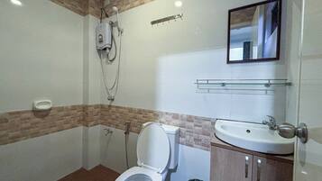 Bidet, towels, soap, toilet paper