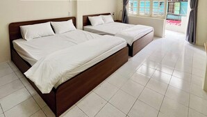 A hotel room with two beds, a tiled floor, and a window with curtains. - 21 Central Transit Stay | 4 Pax | Near MRT & Bus (Thành phố Hồ Chí Minh)