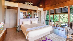 A spacious bedroom with a large bed, wooden ceiling, and a view of the outdoors. - Bell Seaside Luxury Villa (Rawai)