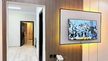 Family Suite, 2 Bedrooms | Living area | TV