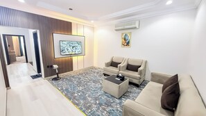 Family Suite, 2 Bedrooms | Living area | TV