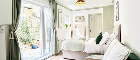 1 bedroom, desk, iron/ironing board, travel crib