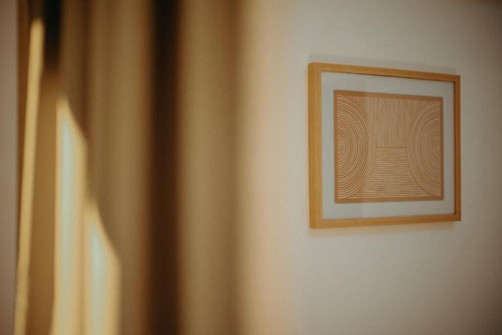 A framed artwork on a wall.