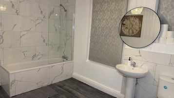 Shower, hair dryer, towels, toilet paper