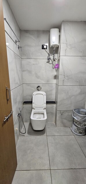 Deluxe Double Room, City View | Bathroom | Shower, slippers, towels, soap - Hotel Rose Gold (Ahmedabad)