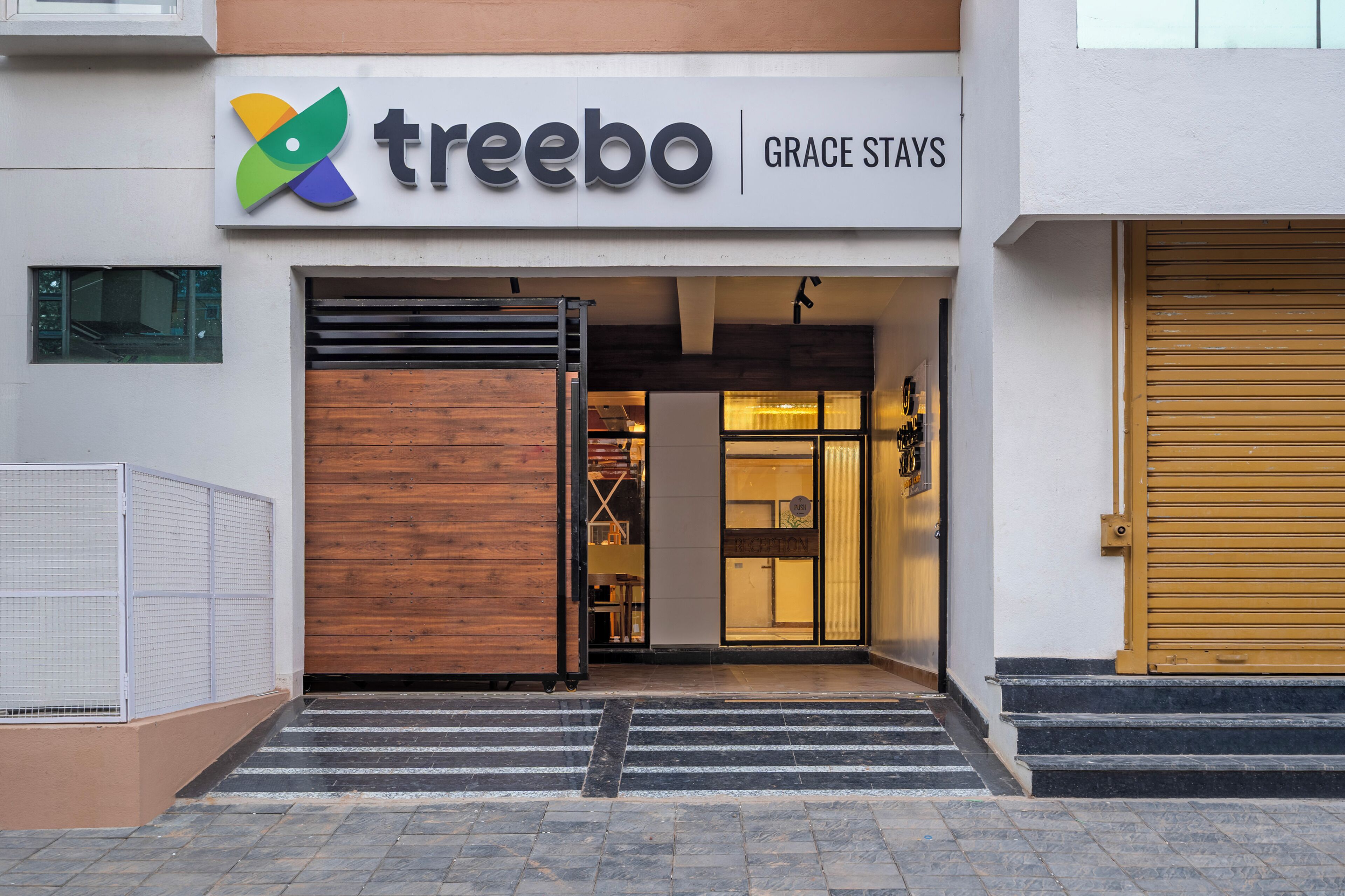 A building with a sign reading 'treebo GRACE STAYS'.