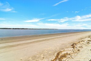 A beach with a sandy shore and calm water. - 1690 Bluff Villas: 3 Bds, Next to South Beach Marina, Free Bikes (Hilton Head Island)