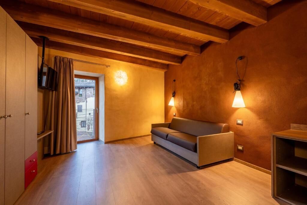 Habitación cuádruple | Área de sala de estar