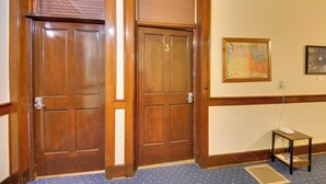 A wooden door with a number 3, a small table with a phone, and a framed map on the wall. - Great for Skiing & Biking! Cozy Dtwn Wallace Condo (Wallace)
