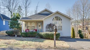 A single-story house with a front porch, a mailbox, and a small front yard with a tree and shrubbery. - 2 Mi to Pickwick Landing State Park: Home w/ Yard (Counce)
