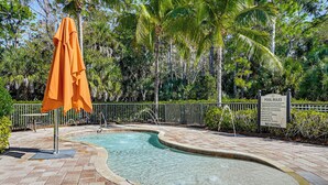 A pool area with a sign indicating pool rules and a 'No Diving' notice. - 8 Mi to Dtwn Naples: Condo w/ Resort Amenities! (Naples)