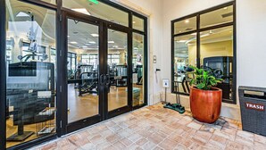 A gym with exercise equipment, a trash can, and a large planter. - 8 Mi to Dtwn Naples: Condo w/ Resort Amenities! (Naples)