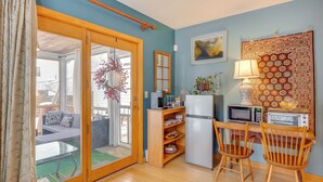 A compact kitchen with a refrigerator, microwave, toaster, and wooden chairs. - 2 Mi to Main Street! Cozy Burlington Guest Suite (Burlington)