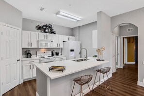 Basic Villa | Private kitchen | Highchair, cookware/dishes/utensils, dining tables - 3bd/2ba Elegant Condo With Resort Access (Kissimmee)