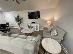 TV, fireplace - Spark Getaways: The Garden of Eden with Sauna (Lubbock)