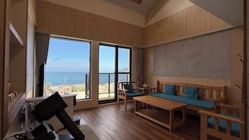 Exclusive Loft, Ocean View | Living area | 55-inch flat-screen TV with digital channels