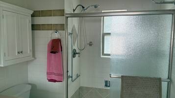 Shower, towels, soap, toilet paper