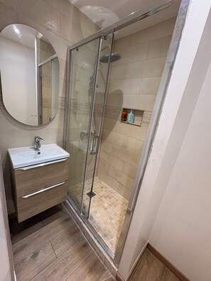 Shower, hair dryer, towels, soap