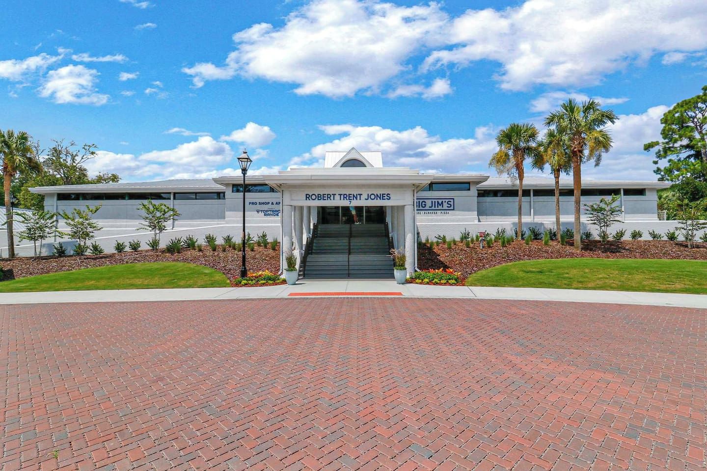 A building with a sign for 'Robert Trent Jones' and 'Big Jim's' across the entrance.