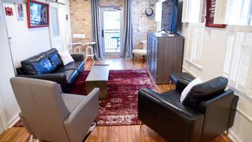 Suite de lujo, vistas a la ciudad | Zona de estar