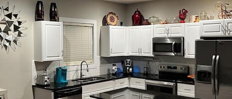 Coffee/tea maker, fridge, microwave, oven
