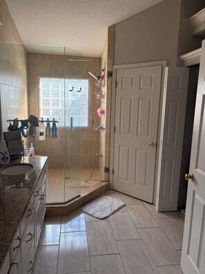 Shower, hair dryer, towels, soap