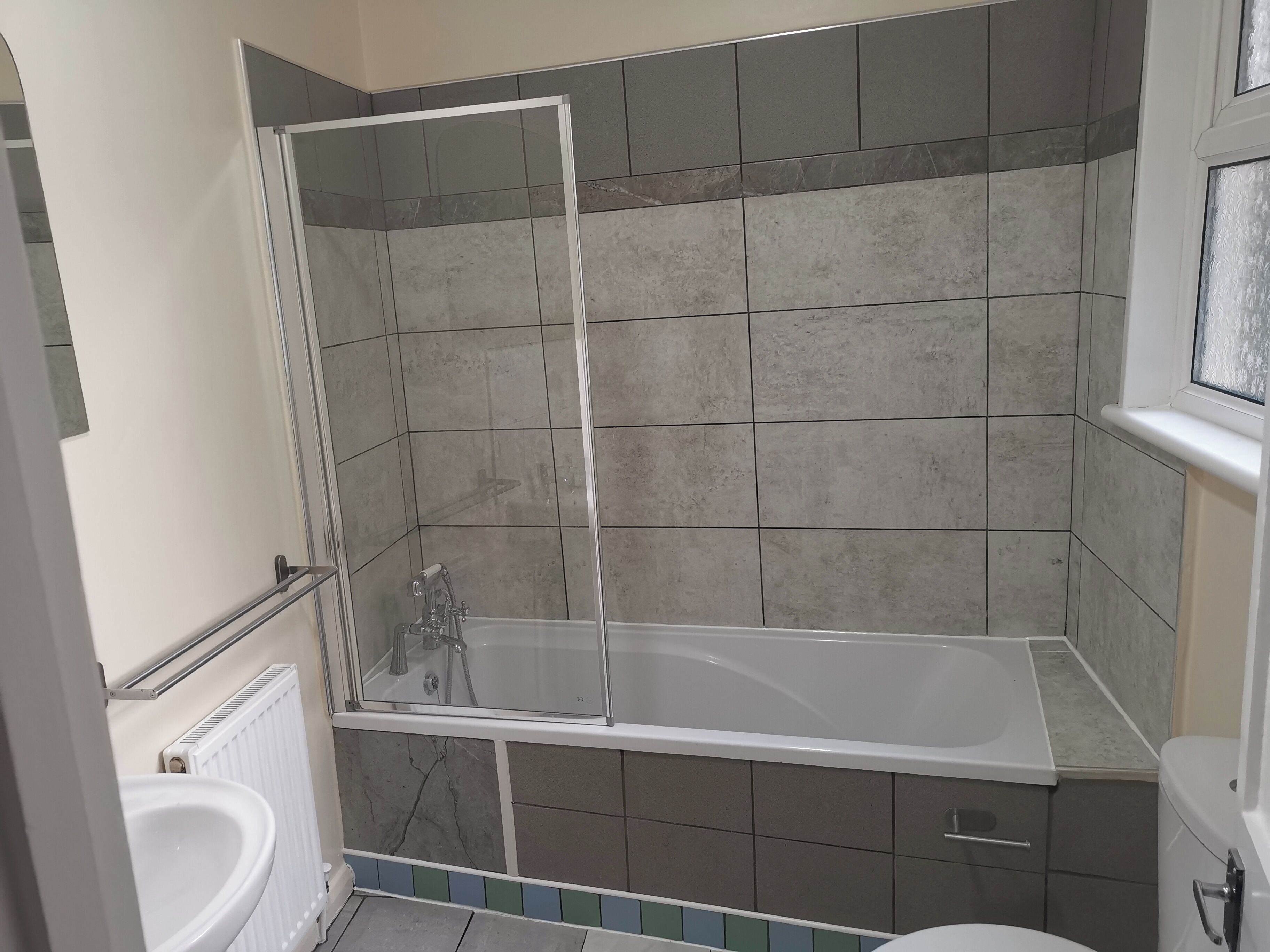 Combined shower/bathtub, deep-soaking bathtub, hair dryer, towels