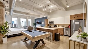 A modern apartment with a pool table, kitchen, and dining area. - Dallas Skyline View Flat w/ Pool, Gym & Free Parking (Dallas)